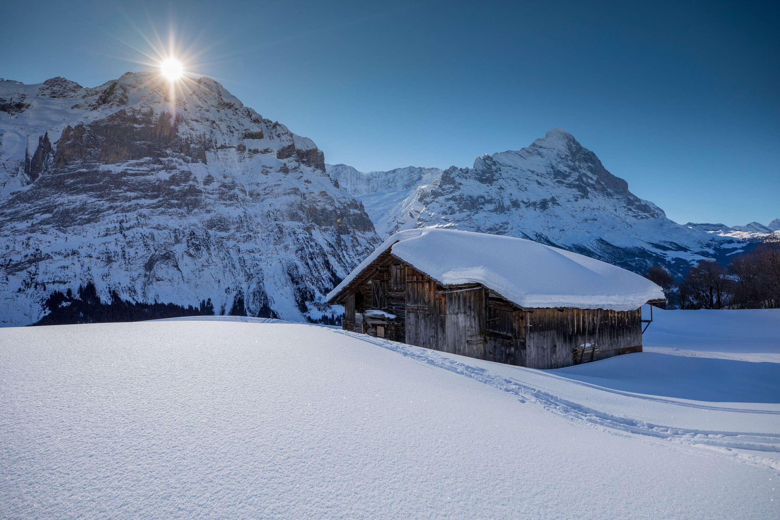 Snow-covered alpine hut near Grindewald First.