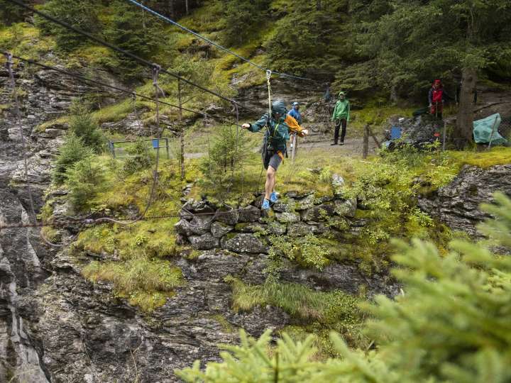 Rope bridge building over the glacier gorge