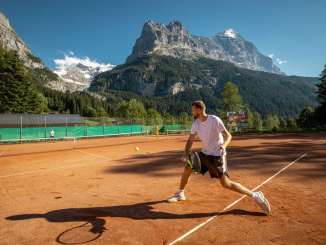Playing tennis in the mountains, on the clay courts in Grindelwald.